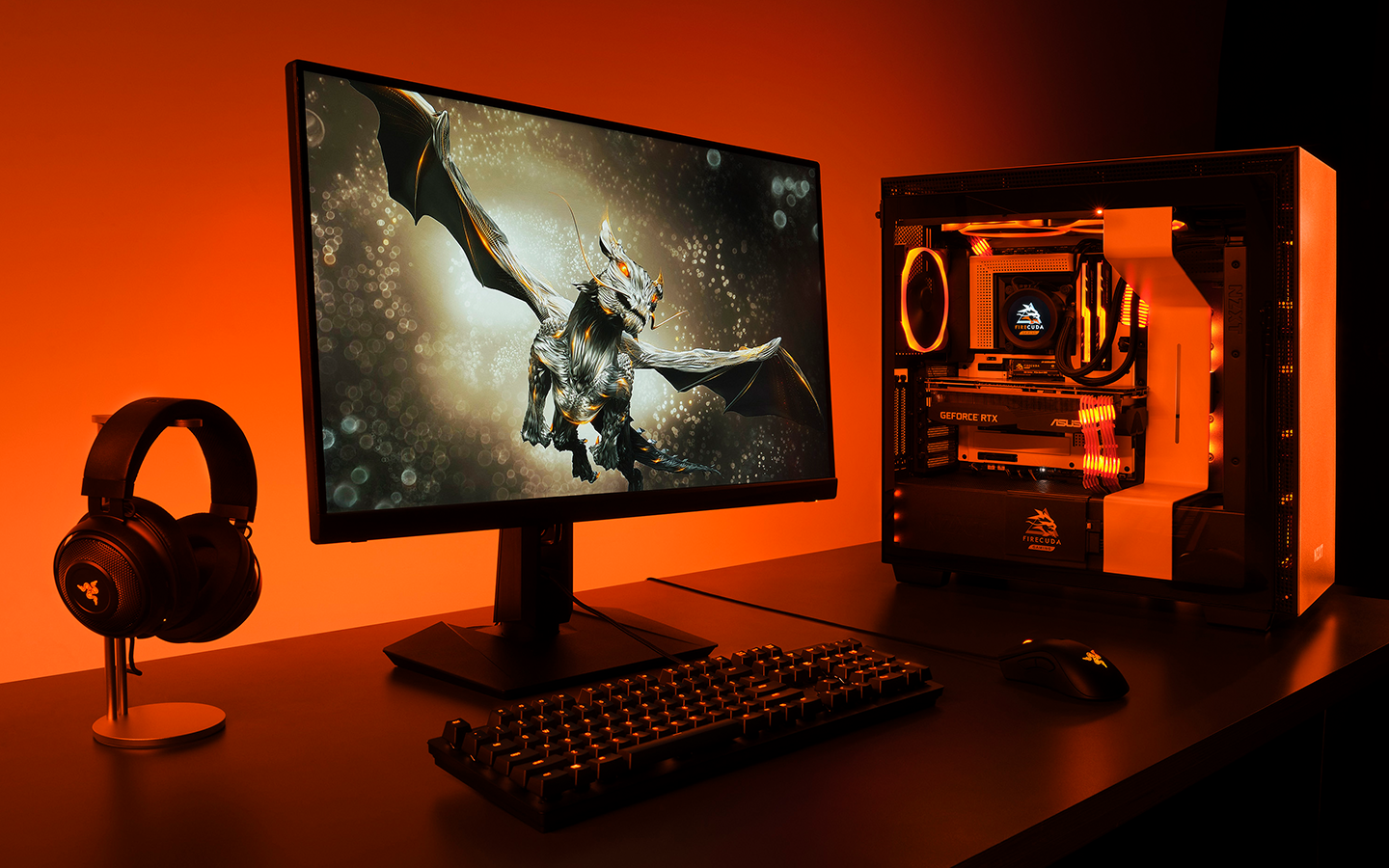 Desktop gaming setup features dragon on monitor, mechanical keyboard, headset on stand and glowing RGB PC case.