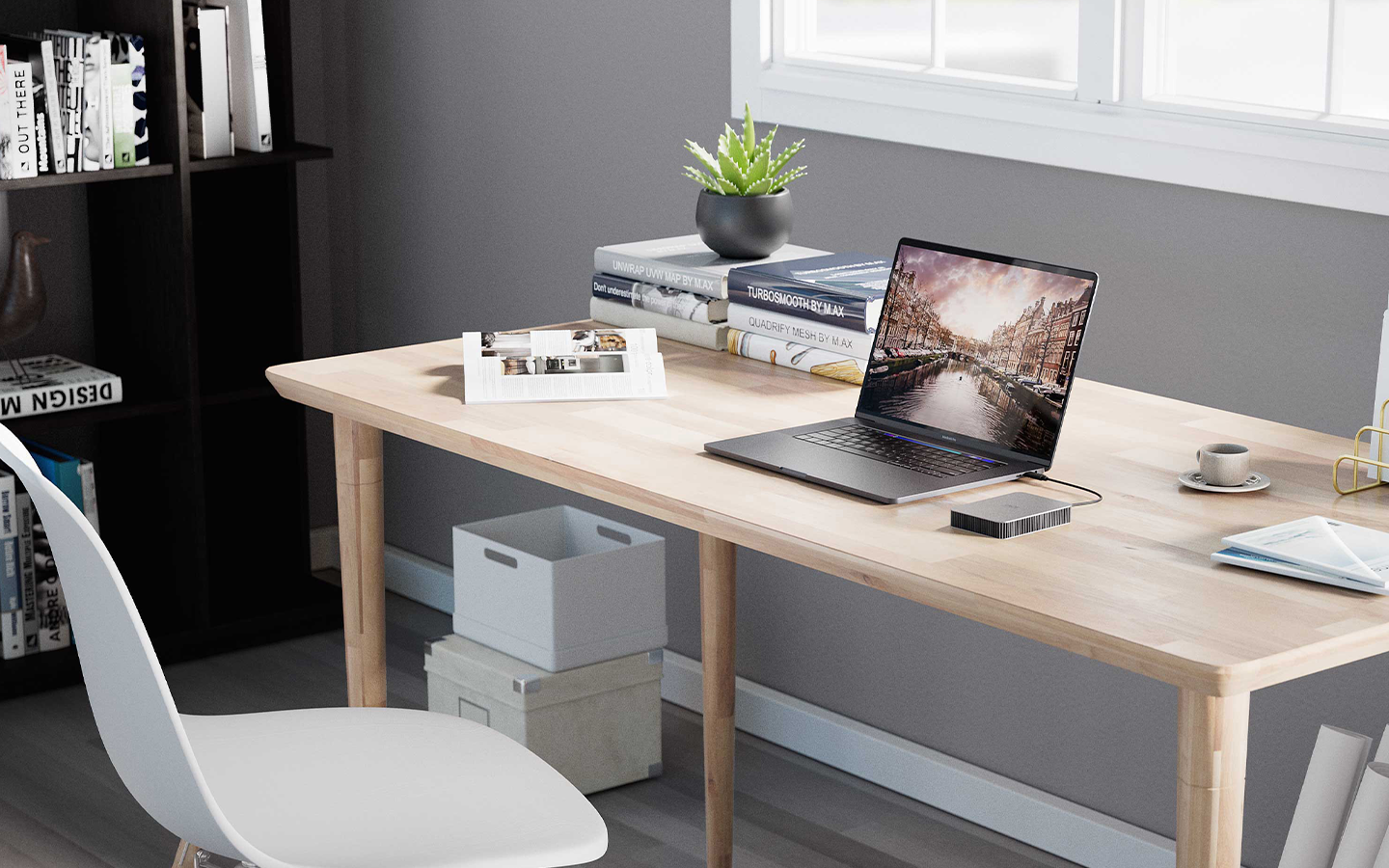 Student desk with laptop and Seagate drive is surrounded by books, shelves, a plant, and chair—organized and study ready.