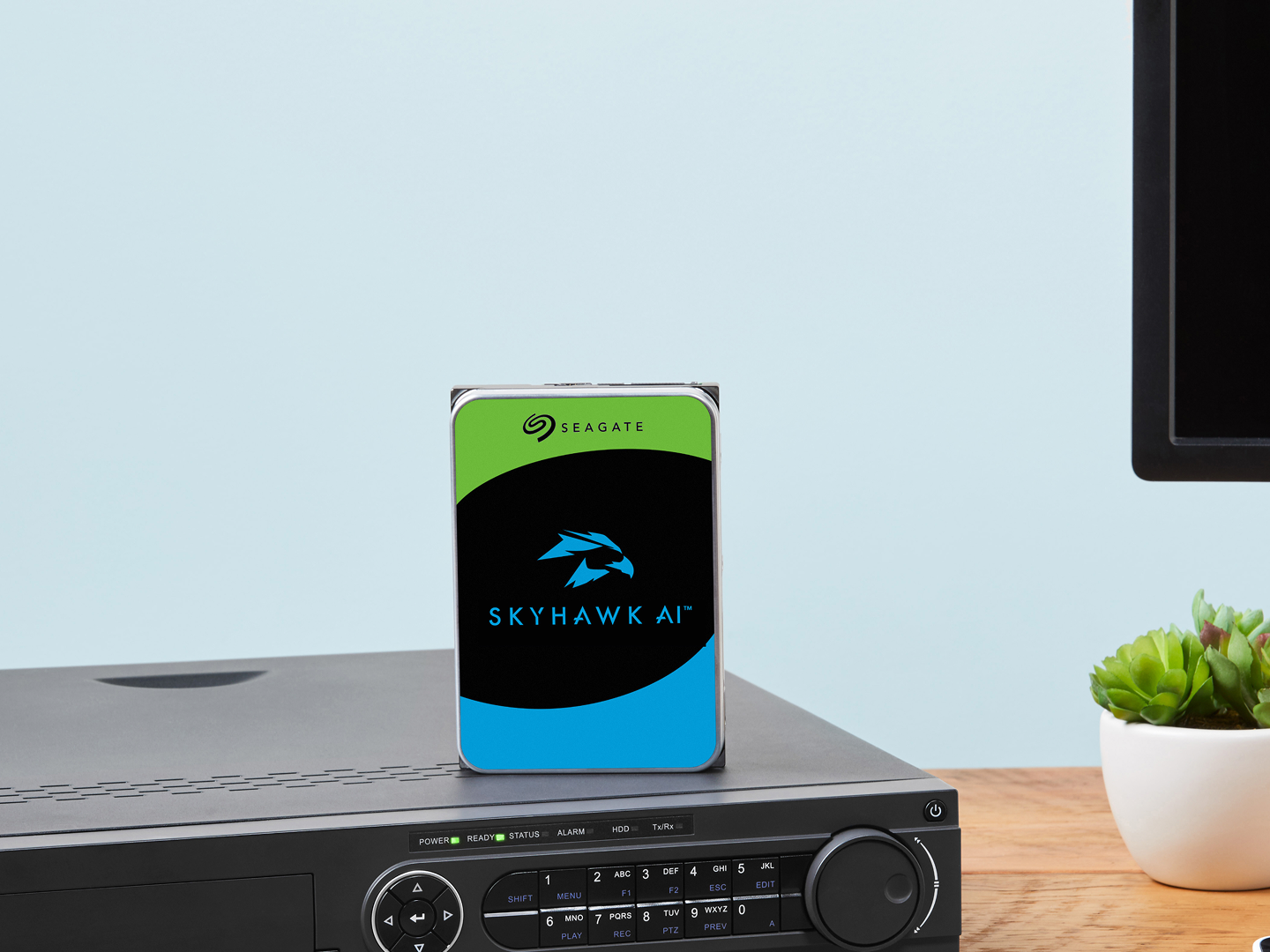 SkyHawk drive sits on a video recorder system which is next to a desktop computer screen and keyboard.