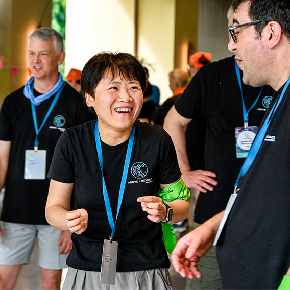 Seagate employees talking and laughing together at a company event.