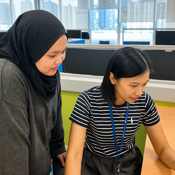 Two employees collaborating on a project in a Seagate workspace.