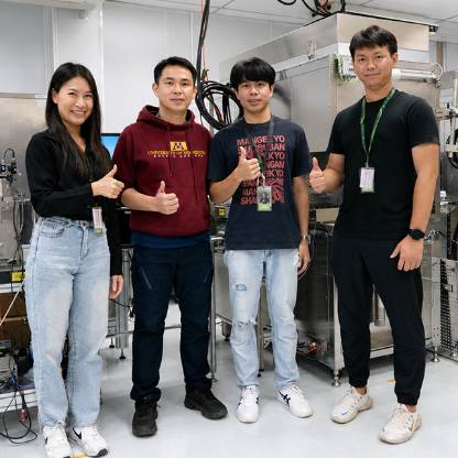 Four Seagate employees standing together in an engineering lab.