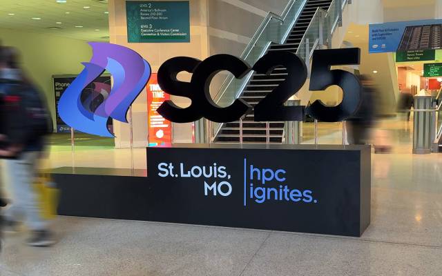 Event sign of SC25 logo with St. Louis, MO and hpc ignites underneath. People are blurred walking by the sign to show movement.